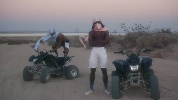 In the new visuals for Blood Orange's stand-out track "Chewing Gum," Dev Hynes and Asap Rocky sport colorful durags as they trek along a dirt road on four-wheelers. 