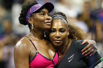 Serena Williams of The United States is congratulated by her sister and opponant Venus Williams.