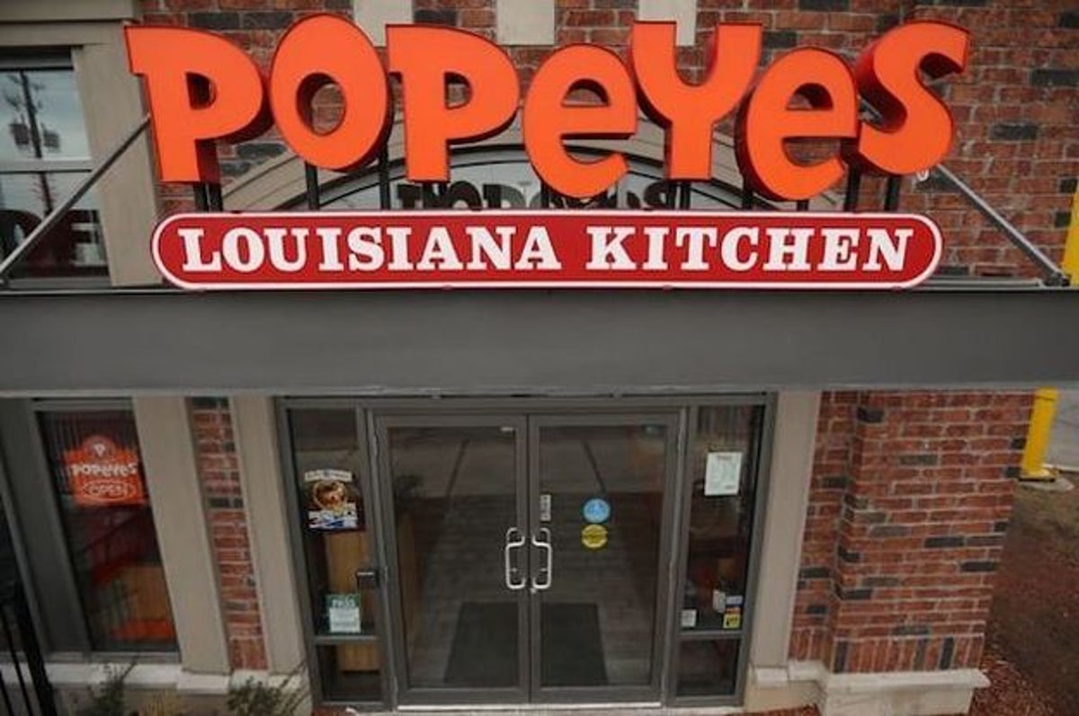 Popeyes serving chicken wings dipped in champagne and gold flakes