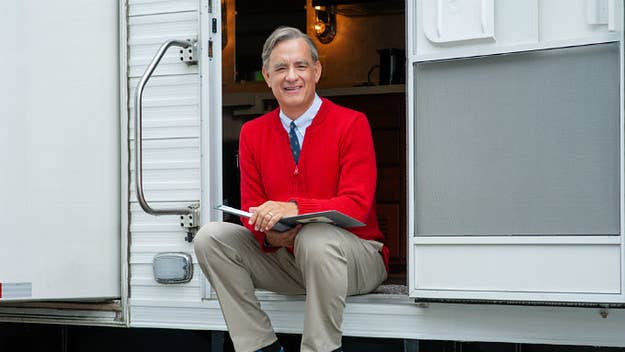 Tom Hanks wears Mister Rogers' iconic sweater and sneakers in the first look for 'You Are My Friend.'