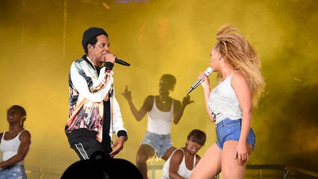 A random person ran on the stage as Beyoncé and JAY-Z were walking off stage during the Atlanta stop of the On the Run II tour on Saturday night. 