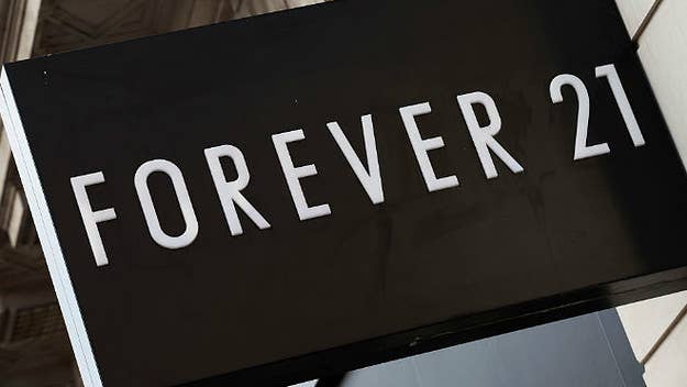 The owners of the Forever 21 and American Eagle stores next to Donald Trump's star on the Hollywood Walk of Fame say the vandalism and crowds around the star is driving customers away.