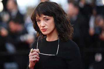 Asia Argento poses as she arrives for the screening of the film 'The Man Who Killed Don Quixote.'