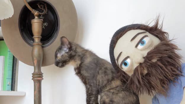 A felty puppet version of Aesop Rock plays with a very real cat in his latest video for "Kirby."