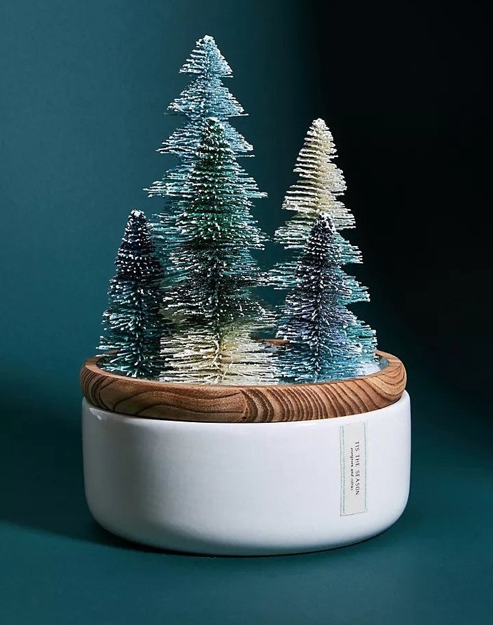 A frosted bottle brush tree candle