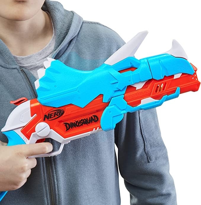 Kid holding Nerf gun