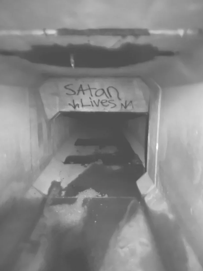 A sign indicating where Satan lives