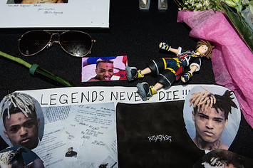 A fan made poster at XXXTentacion's funeral.