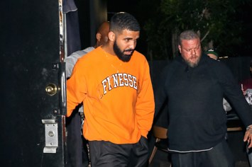 Drake in an orange "Finesse" sweatshirt.
