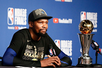 Kevin Durant #35 of the Golden State Warriors talks to the media