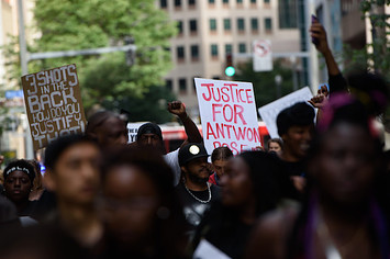 Protestors at a rally asking for justice for Antwon Rose.