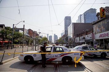 Toronto police at the scene where Smoke Dawg was shot.