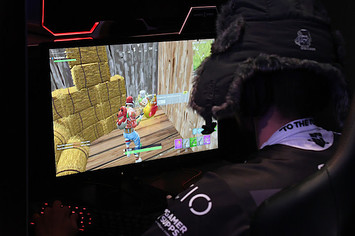 A gamer plays 'Fortnite' against Twitch streamer.