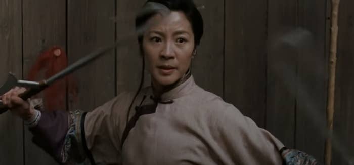 Michelle Yeoh holding weapons in Crouching Tiger, Hidden Dragon