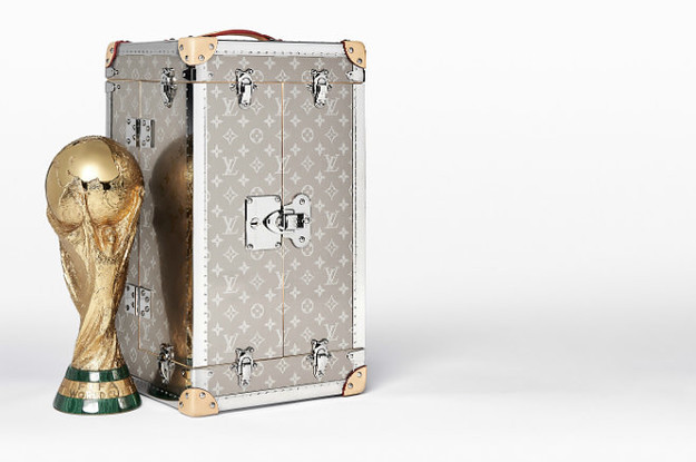 A Louis Vuitton trunk with World Cup match balls from 1970 for