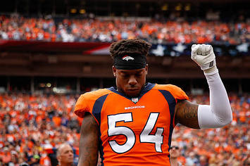 Inside linebacker Brandon Marshall of the Denver Broncos stands and holds a fist in the air.