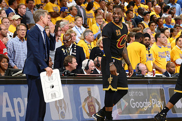 Steve Kerr of the Golden State Warriors talks to LeBron James.