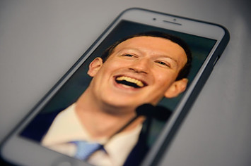A photo of Facebook founder and CEO Mark Zuckerberg on an iPhone