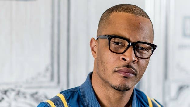 Security footage has surfaced of T.I. getting booked early Wednesday morning.