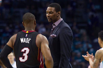 Chris Bosh talks to Dwyane Wade during a timeout against the Hornets in the 2016 playoffs.