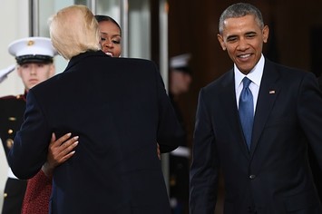 Donald Trump hugs Michelle Obama.