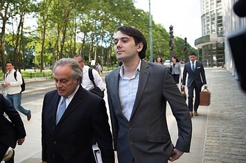 Ex pharmaceutical executive Martin Shkreli leaves with his lawyer Benjamin Brafman