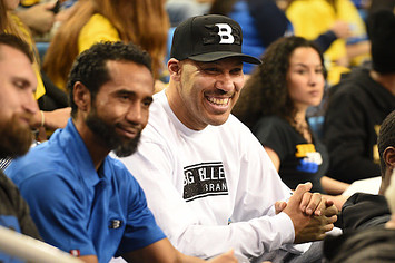LaVar Ball looks on during a college basketball game