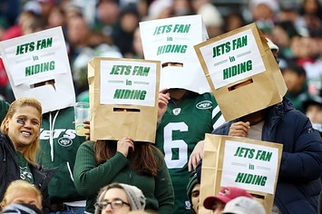 Jets fans with bags on their heads.