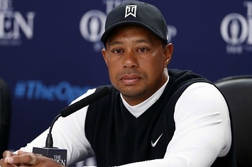 Tiger Woods answers questions at a press conference.