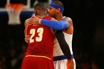 Carmelo Anthony hugs LeBron James after a game.