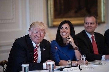 Donald Trump smiles during a roundtable