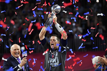 Tom Brady raises Lombardi Trophy following Patriots' Super Bowl LI victory.