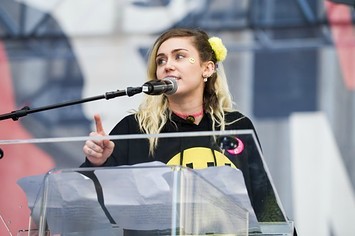 Miley Cyrus speaks at a rally.