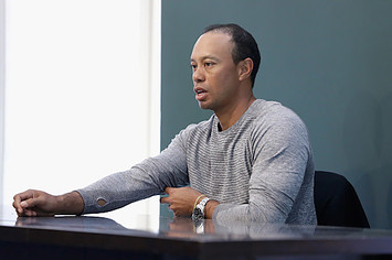 Tiger Woods signs copies of his new book 'The 1997 Masters: My Story'