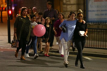 Members of the public are escorted from the Manchester Arena