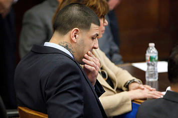 Aaron Hernandez sits at the defense table during jury deliberations in his double murder trial.