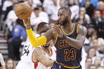 LeBron James passing off to teammate during game.