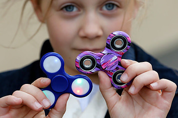 a child shows a 'Hand Spinner' on May 20, 2017 in Paris, France.