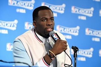 Draymond Green responds to a question at a press conference.
