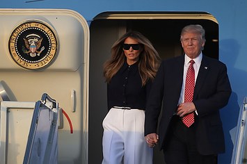 Donald Trump and his wife Melania Trump arrive on Air Force One