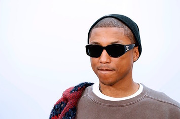 Pharrell Williams poses during the photocall before the Chanel women's fashion show
