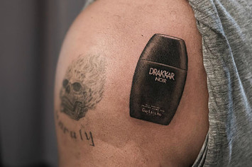 Drake's Drakkar Noir tattoo