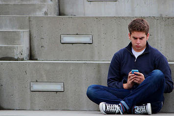 Some guy texting by himself.