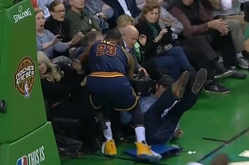 LeBron James nearly collides with Bill Belichick.
