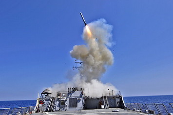 U.S. Navy guided missile destroyer USS Barry (DDG 52) launches a Tomahawk cruise missile