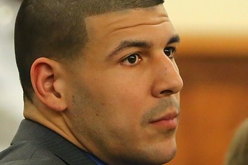 Aaron Hernandez listens during his murder trial.