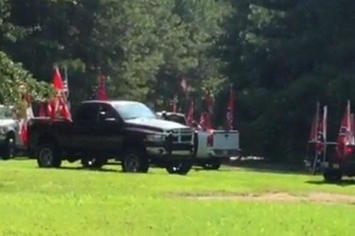 Couple shows off Confederate flags on their pick up truck.