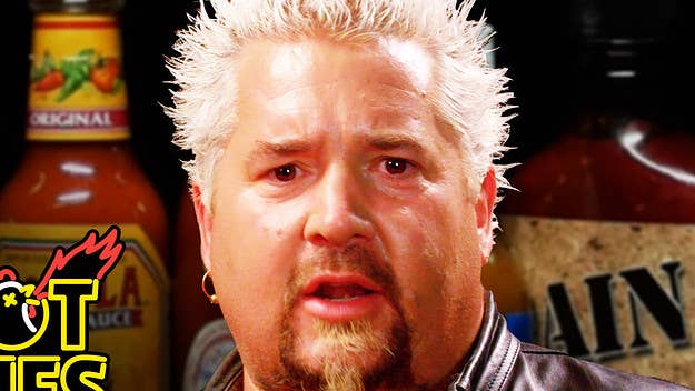 Guy Fieri takes on the Hot Ones challenge with host Sean Evans.