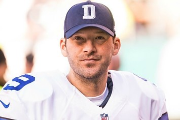 Tony Romo stands on the sideline during a Cowboys game last season.