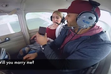 Man throws up during plane proposal.